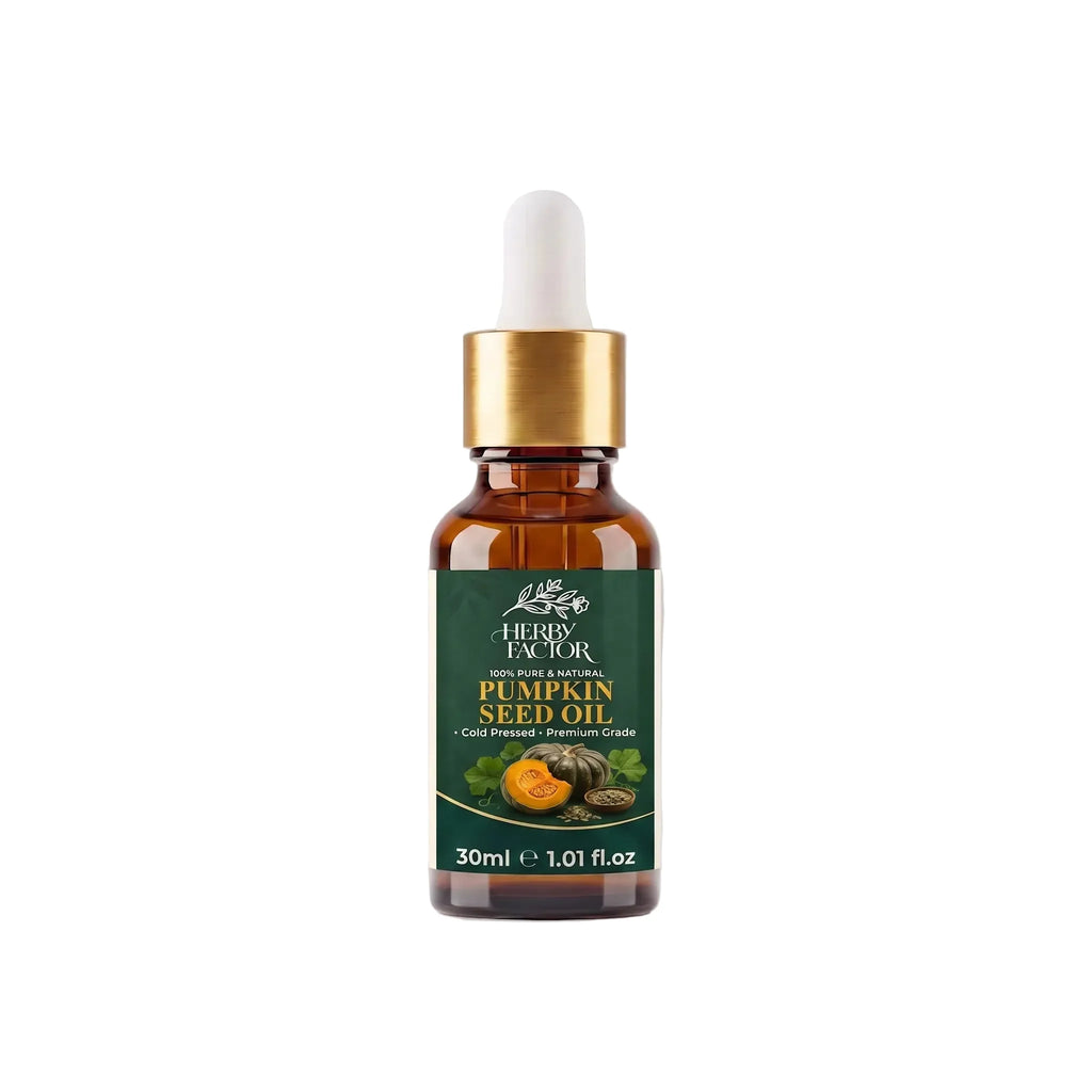 A 30ml amber glass dropper bottle of Herby Factor Pumpkin Seed Oil Cucurbita Pepo Roghan-e-Kaddu with a gold collar and white bulb, set against white background with a soft reflection.