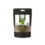 A black stand-up window pouch package displaying pure raw Tulsi Leaves Holy Basil Ocimum sanctum by Herby Factor Pakistan