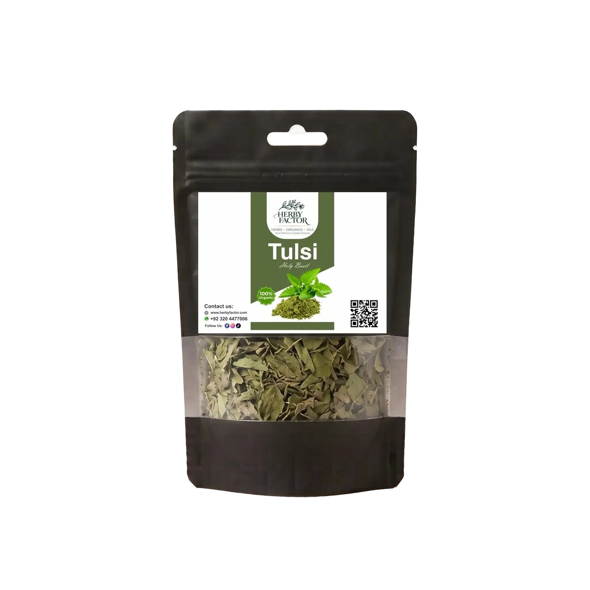 A black stand-up window pouch package displaying pure raw Tulsi Leaves Holy Basil Ocimum sanctum by Herby Factor Pakistan
